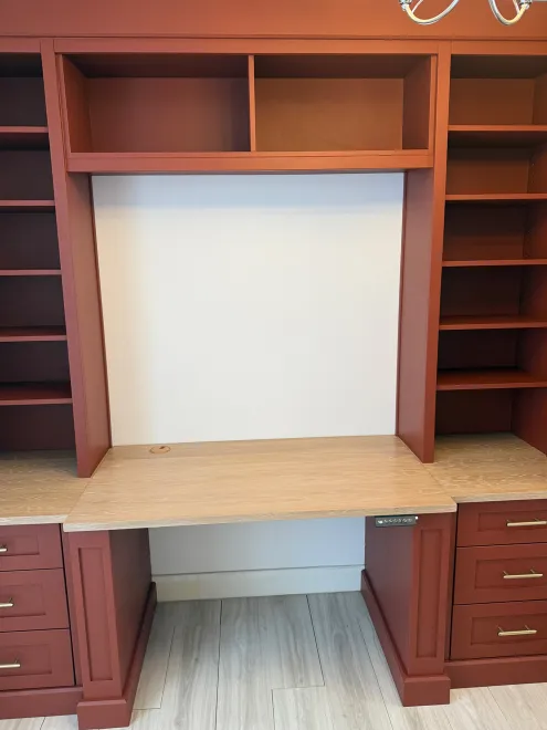 Terracotta desk bay with open shelving, an oak worktop and drawers either side